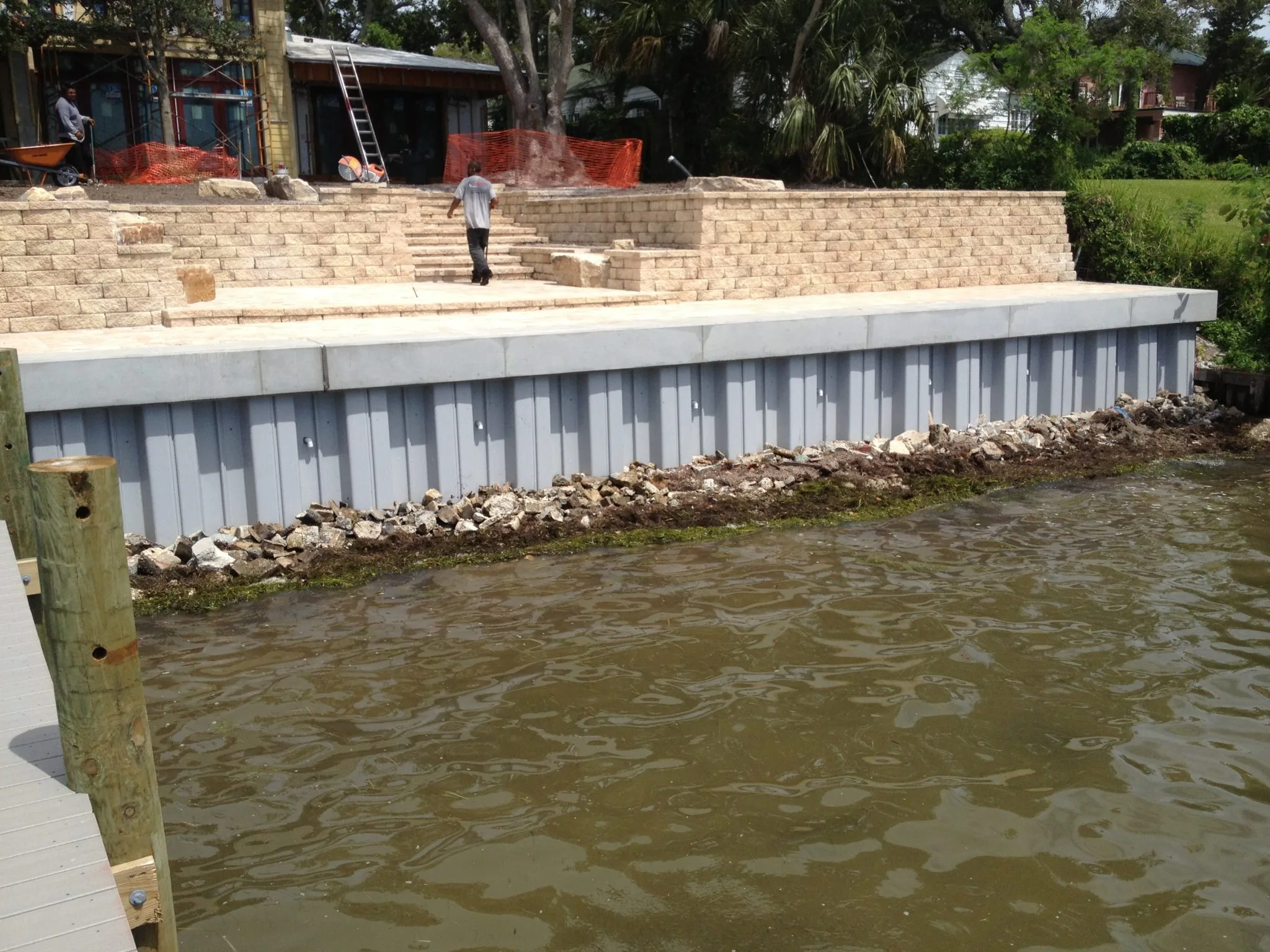 Rip rap and vinyl seawall being installed by Gibson Marine